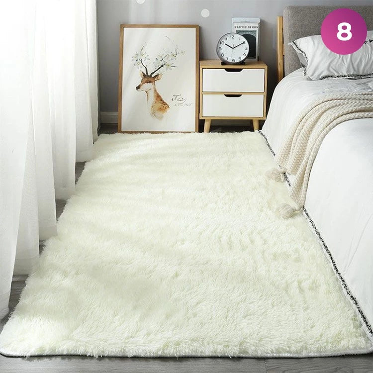 An Ultra Soft Indoor Rug is placed in a room next to the bed