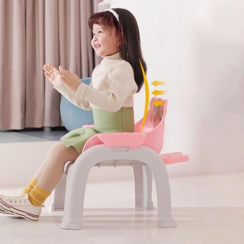 girl enjoying her time in baby chair