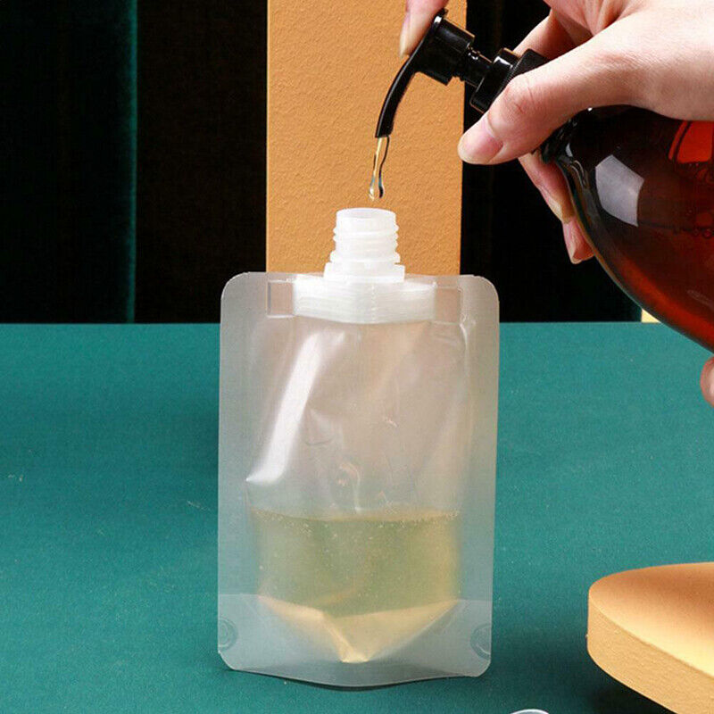 A hand pouring liquid into a Reusable Shampoo Lotion Liquid Dispenser Bags