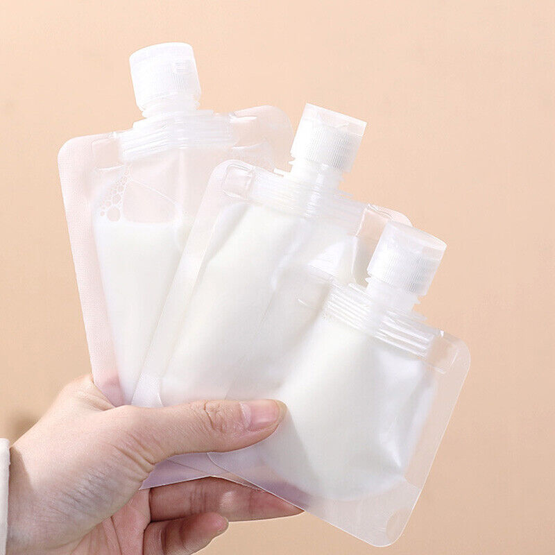A hand holding plastic Reusable Shampoo Lotion Liquid Dispenser Bags