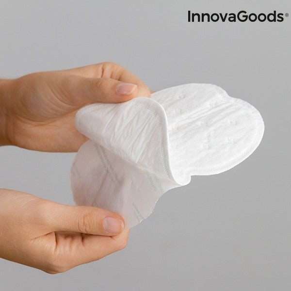 Someone is holding Disposable Cotton Unisex Underarm Sweat Pads