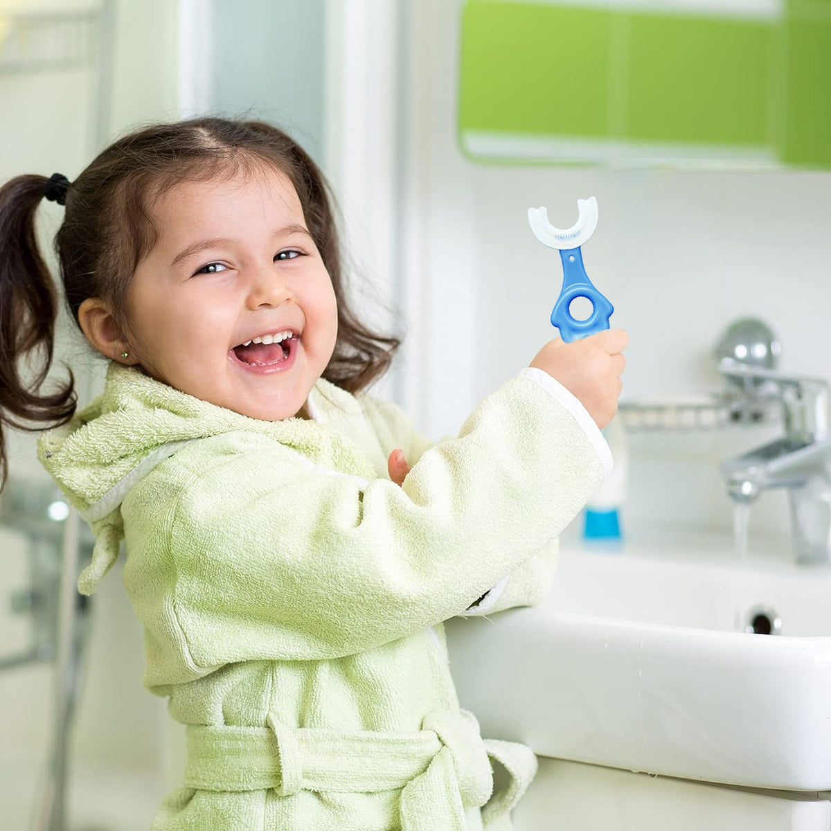 A girl holding blue color U-Shaped Kids Toothbrush