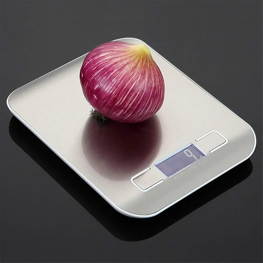 A 10 Kg/ 22 lbs Stainless Steel Digital Kitchen Food Scale with Onion on it.