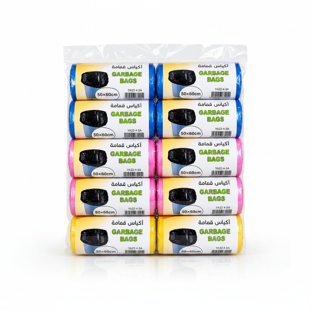 Packaged rolls of garbage bags on a wooden surface with greenery.