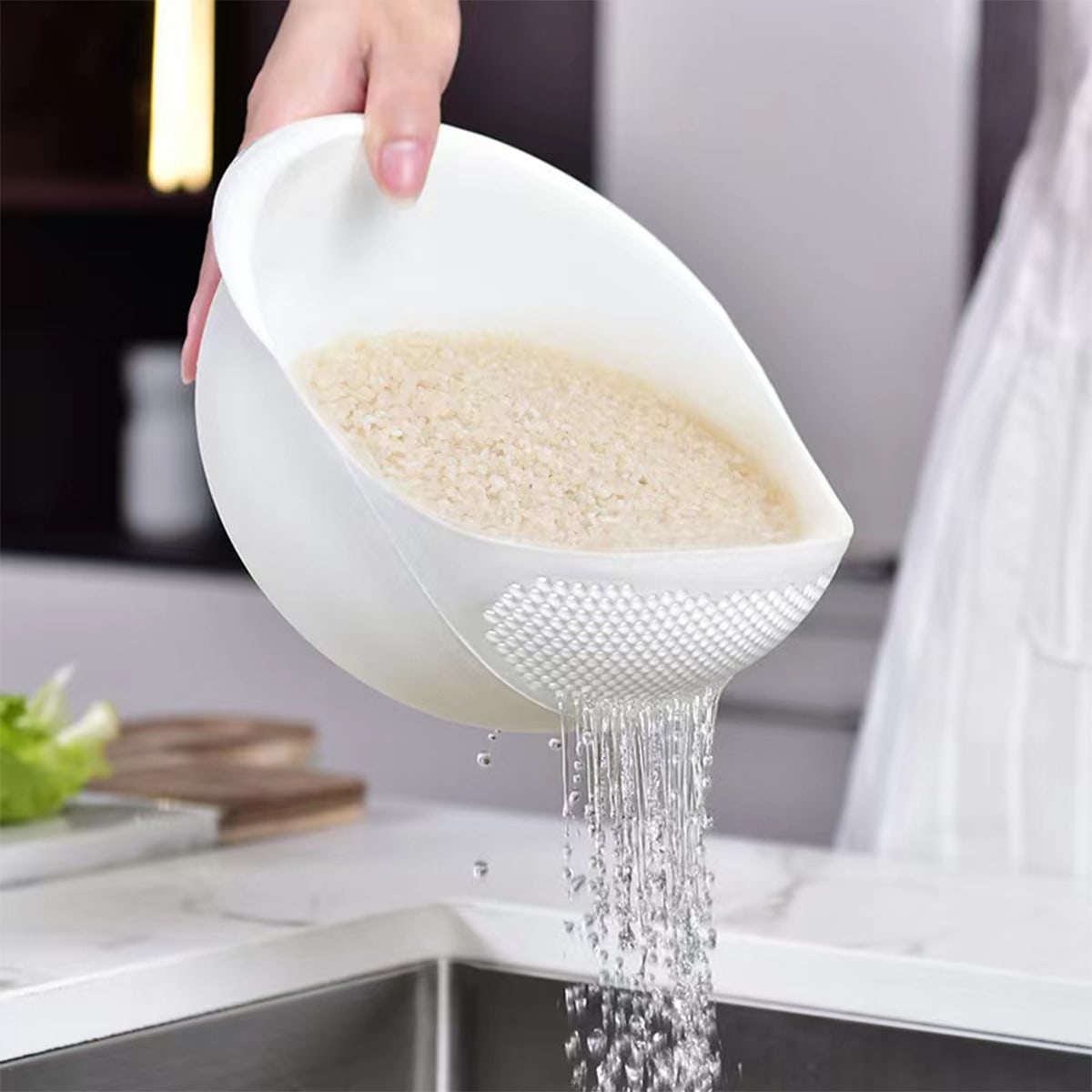 Rice being washed with the help of Plastic Rice Washing Strainer Basket