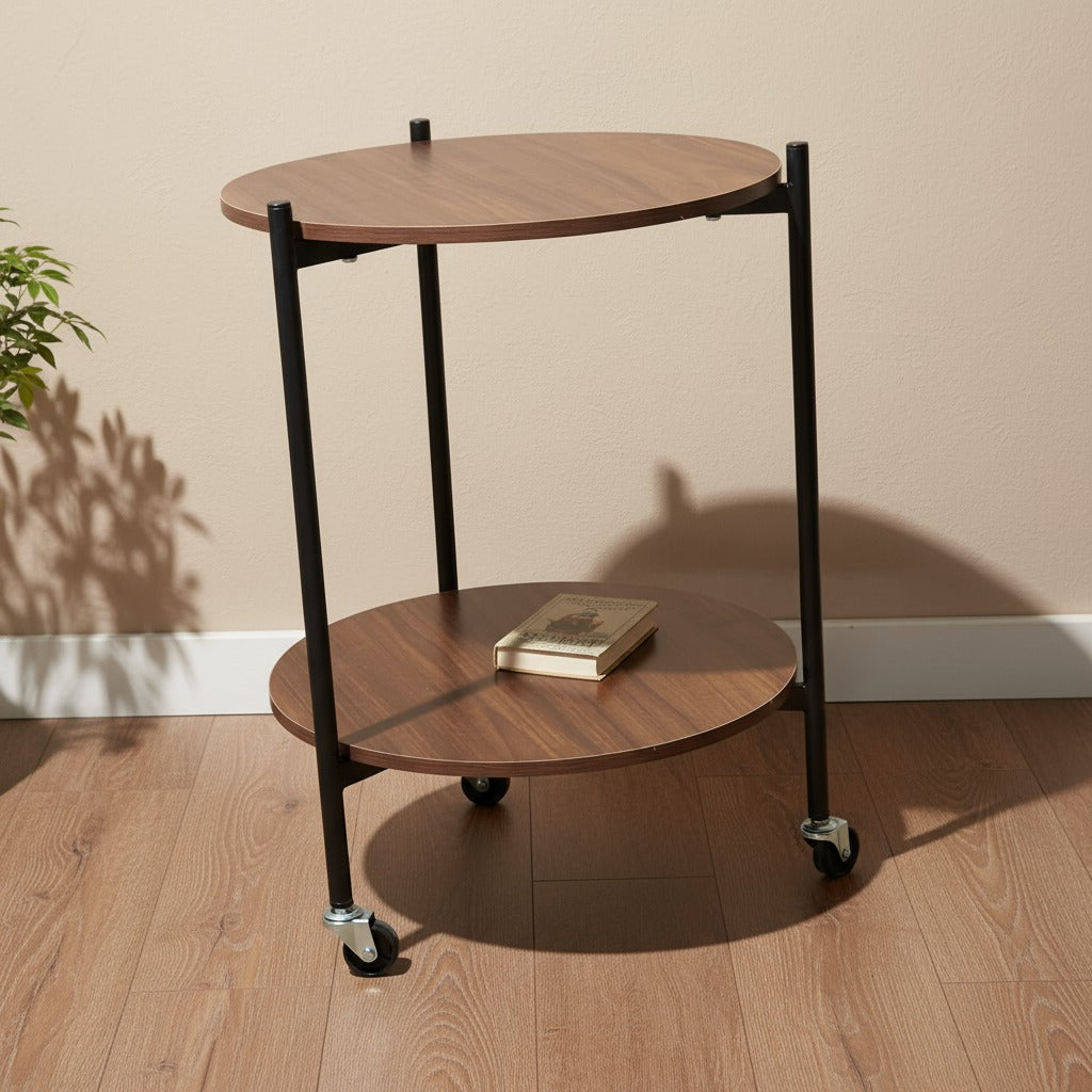 A 2-Tier Wooden Round Rolling Side Table with a Book on it.