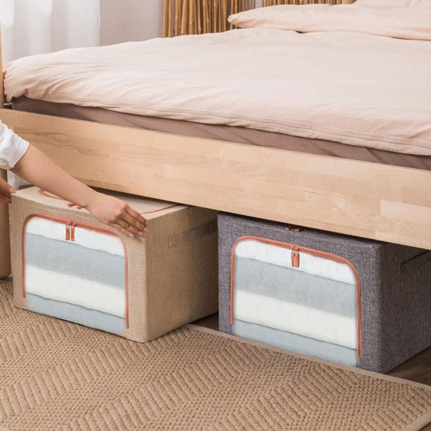 a person placing 2 x 66L Foldable Large Capacity Cloth Storage under a bed