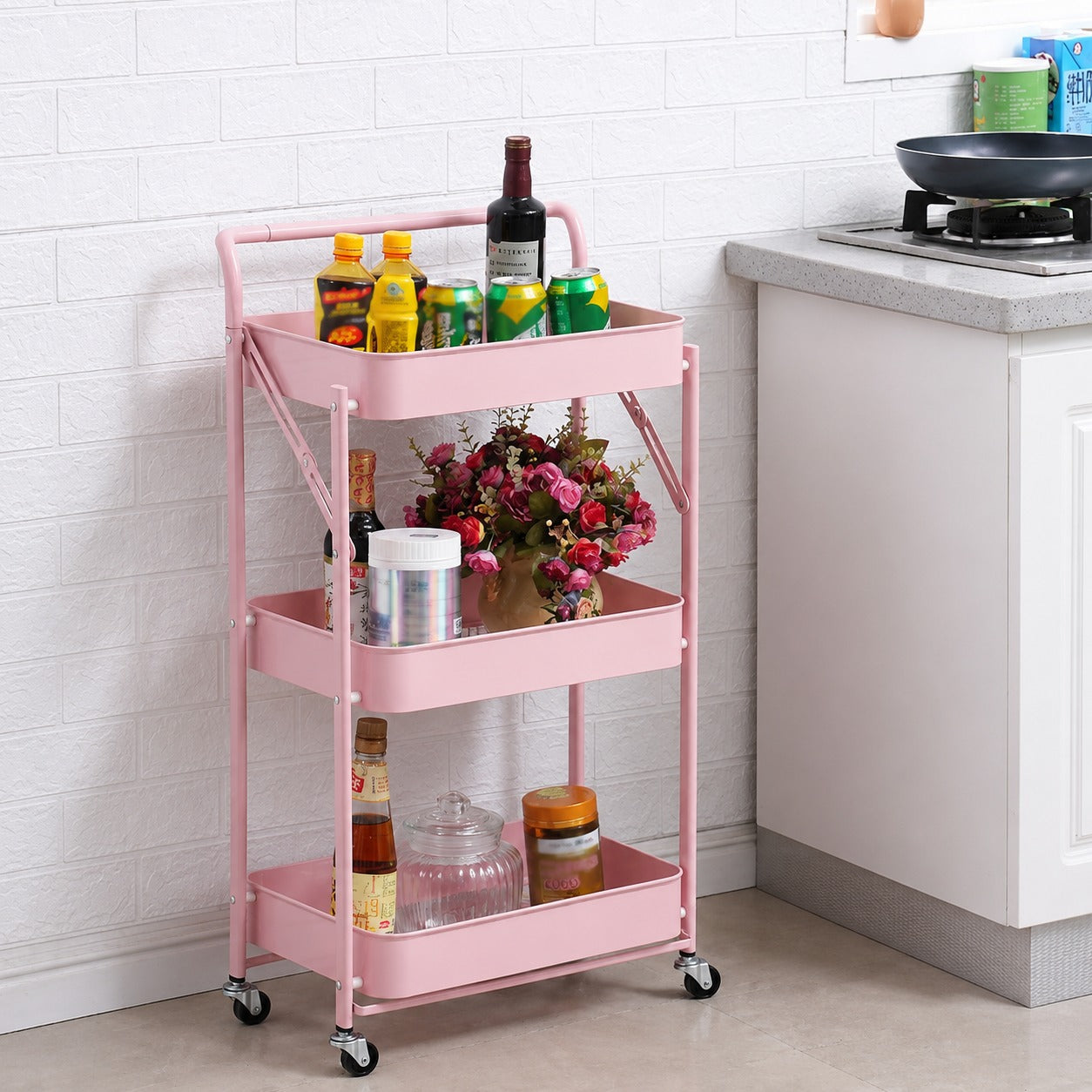 3-Tier Rolling Metal Storage Cart  in a kitchen with various items on it