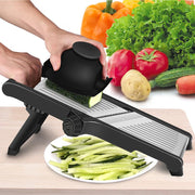 A Person is slicing cucumber using 3-in-1 Adjustable Mandoline Slicer.