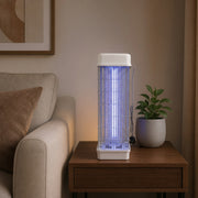 360° Electric Insect Killer Lamp on a wooden side table with a couch and plant in the background