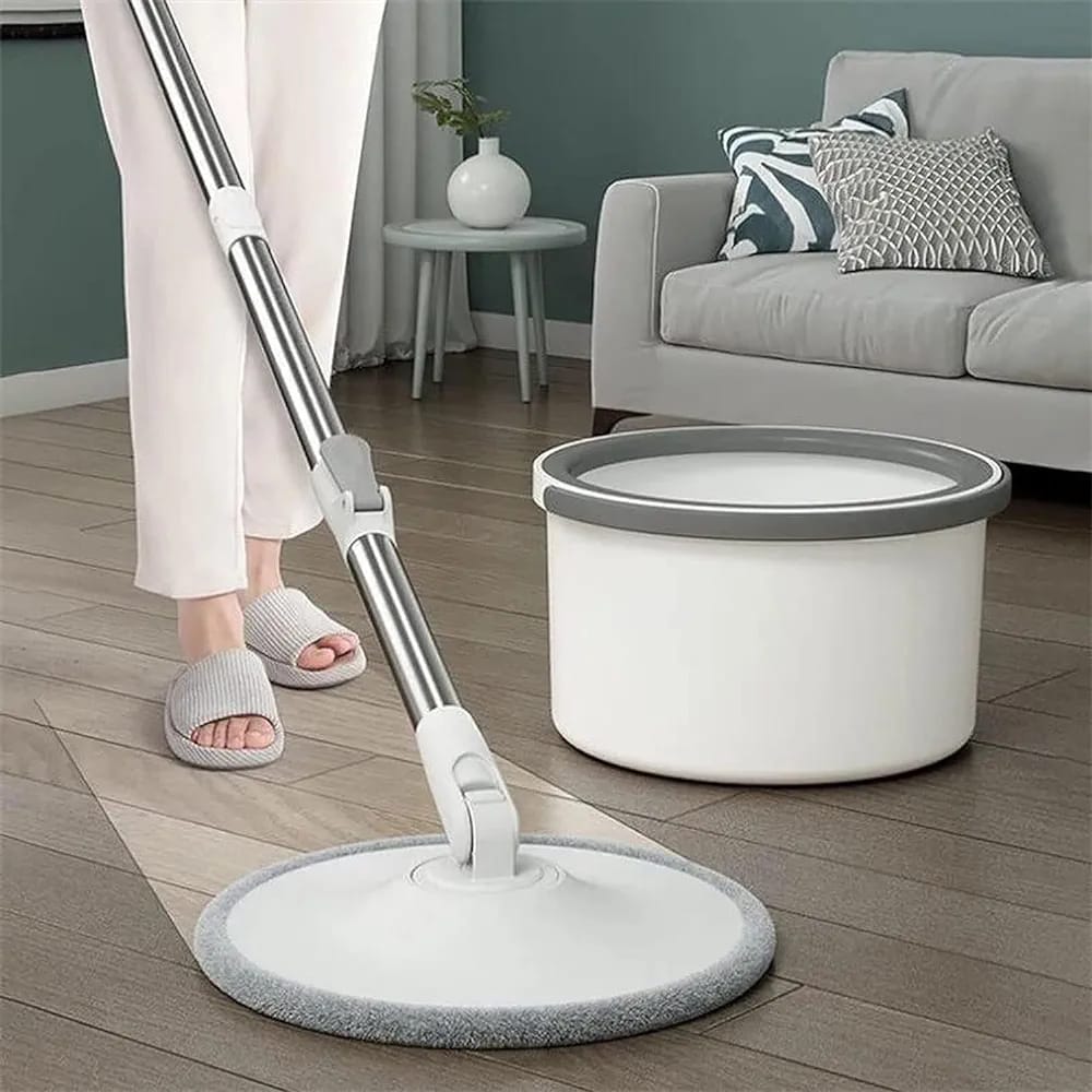 Someone is cleaning the floor with the help of a 360° Spin Mop and Bucket Set