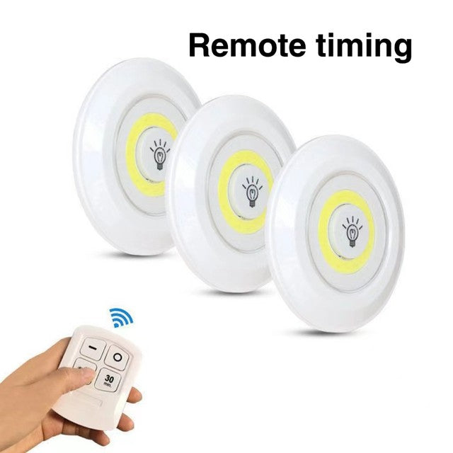 A Person is Operating 3 Pcs Dimmable LED Under Cabinet Light with Remote Control