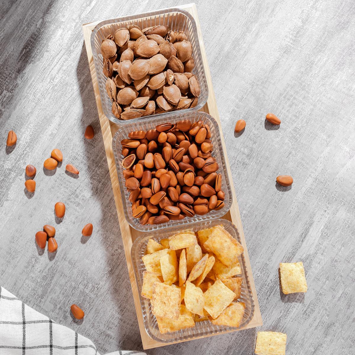 3 Pcs Glass Serving Bowls with nuts and chips on a textured surface