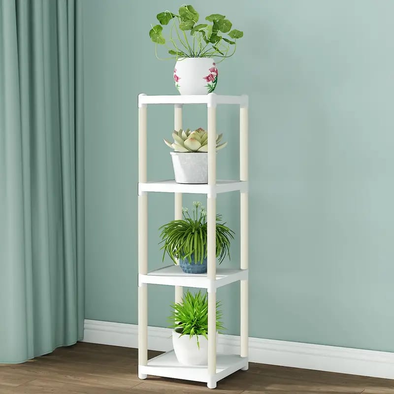 4- Tier White Flower Rack Stand With Plants Are Arranged On it.