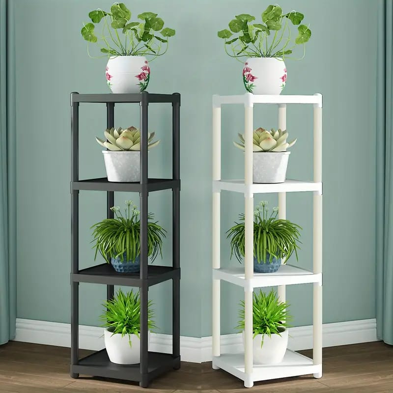 4- Tier Black and White Flower Rack Stands With Plants Are Arranged On it.