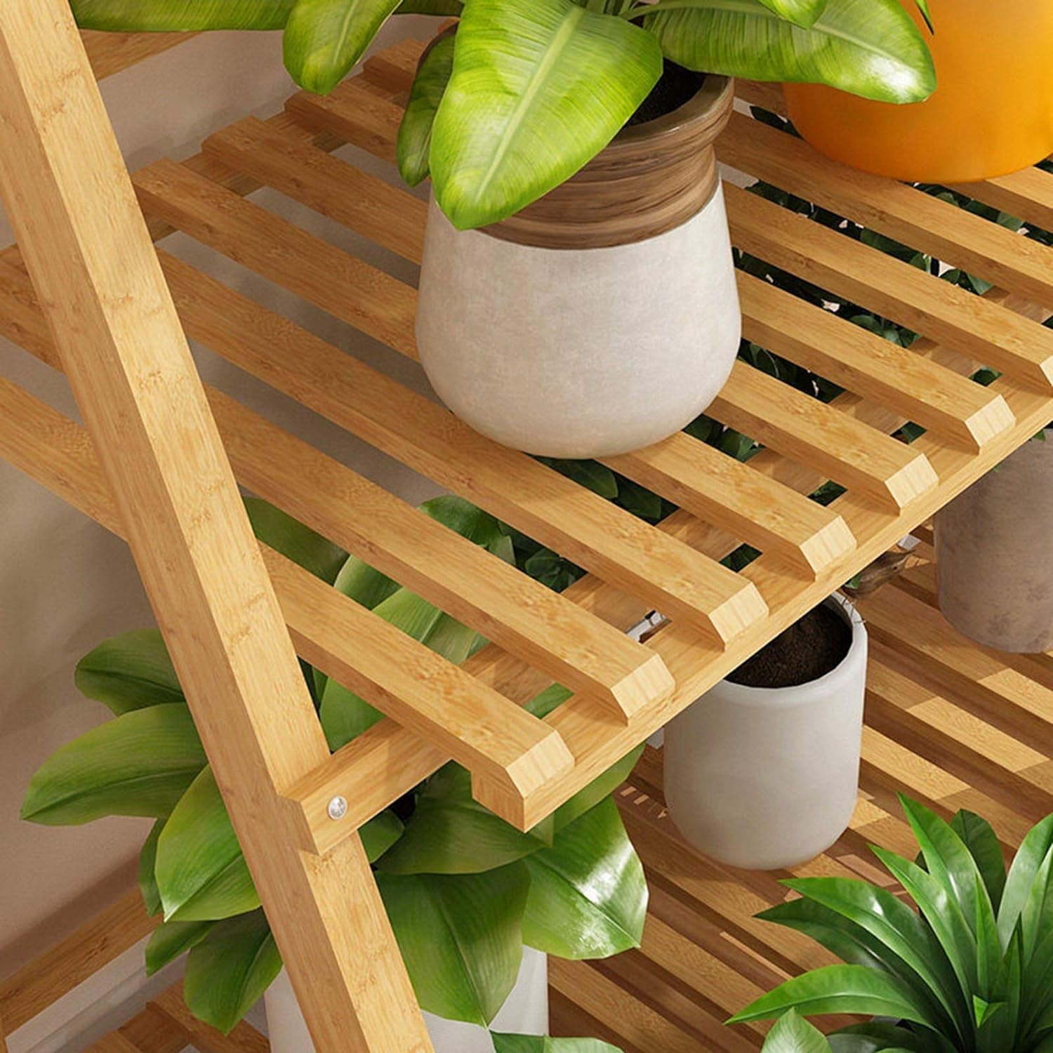 A close-up view captures the intricate details of the 4-Layer Foldable Indoor Wooden Plant Stand