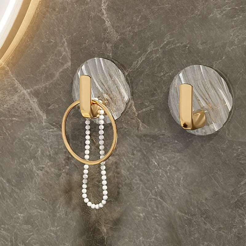 Some Jewelries are Hanged on the Self Adhesive Wall Hooks.
