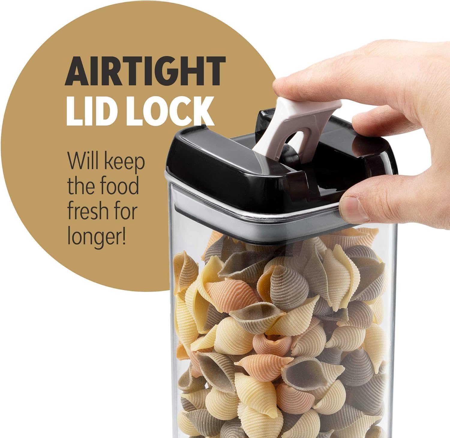 Container with airtight lid lock filled with pasta, hand holding the lid.