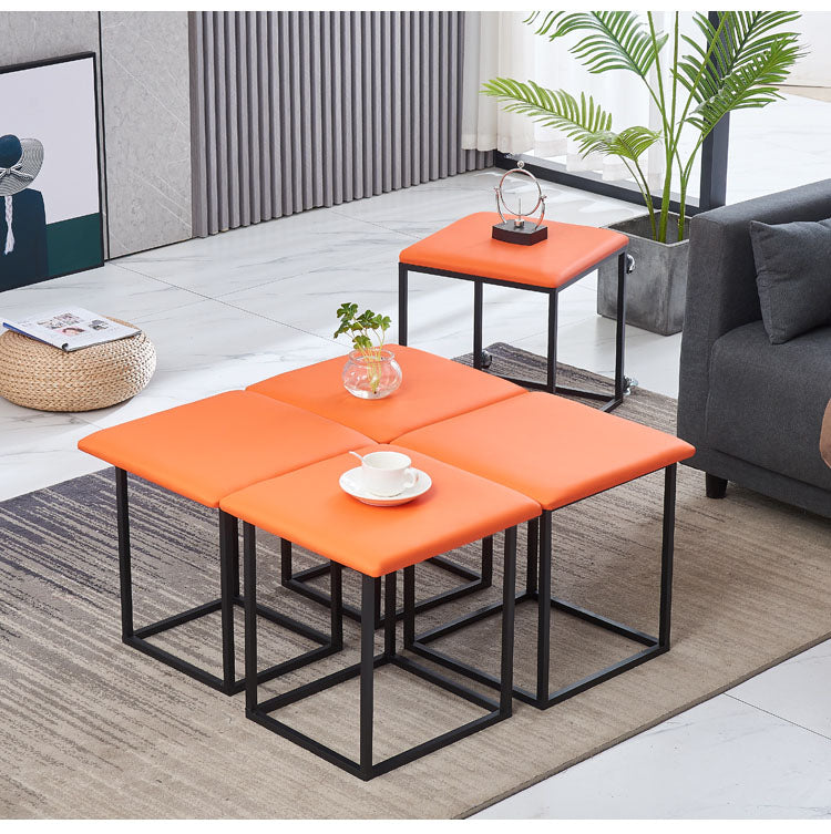 A 5-in-1 Nesting Ottoman Stools are Arranged at Living Area.