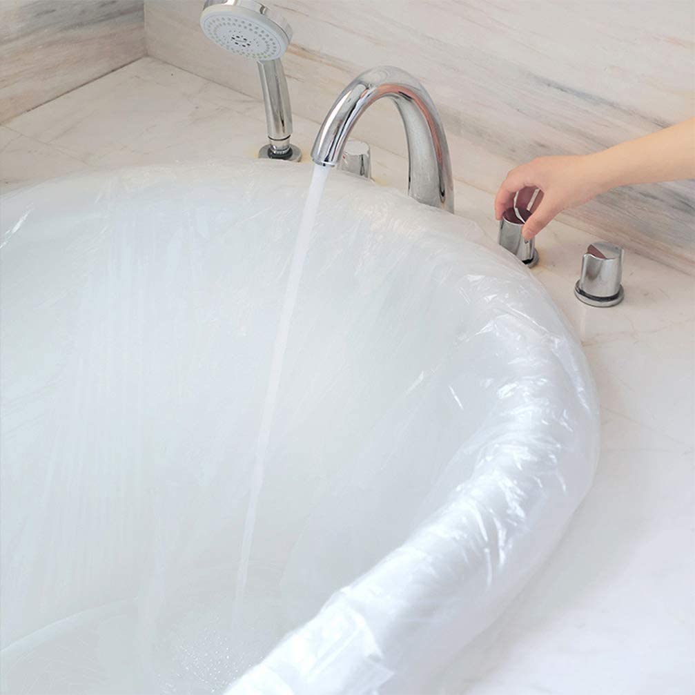 A bath covered with a portable clear disposable bathtub bathing cover
