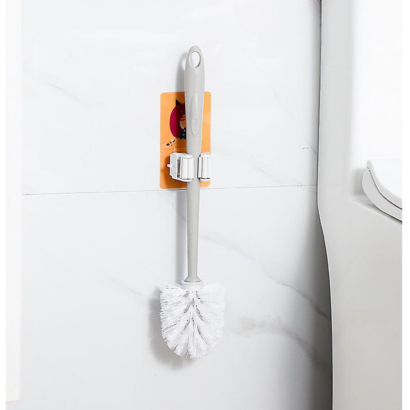 a toilet brush on a  Wall Mount Mop Brush Broom Holder