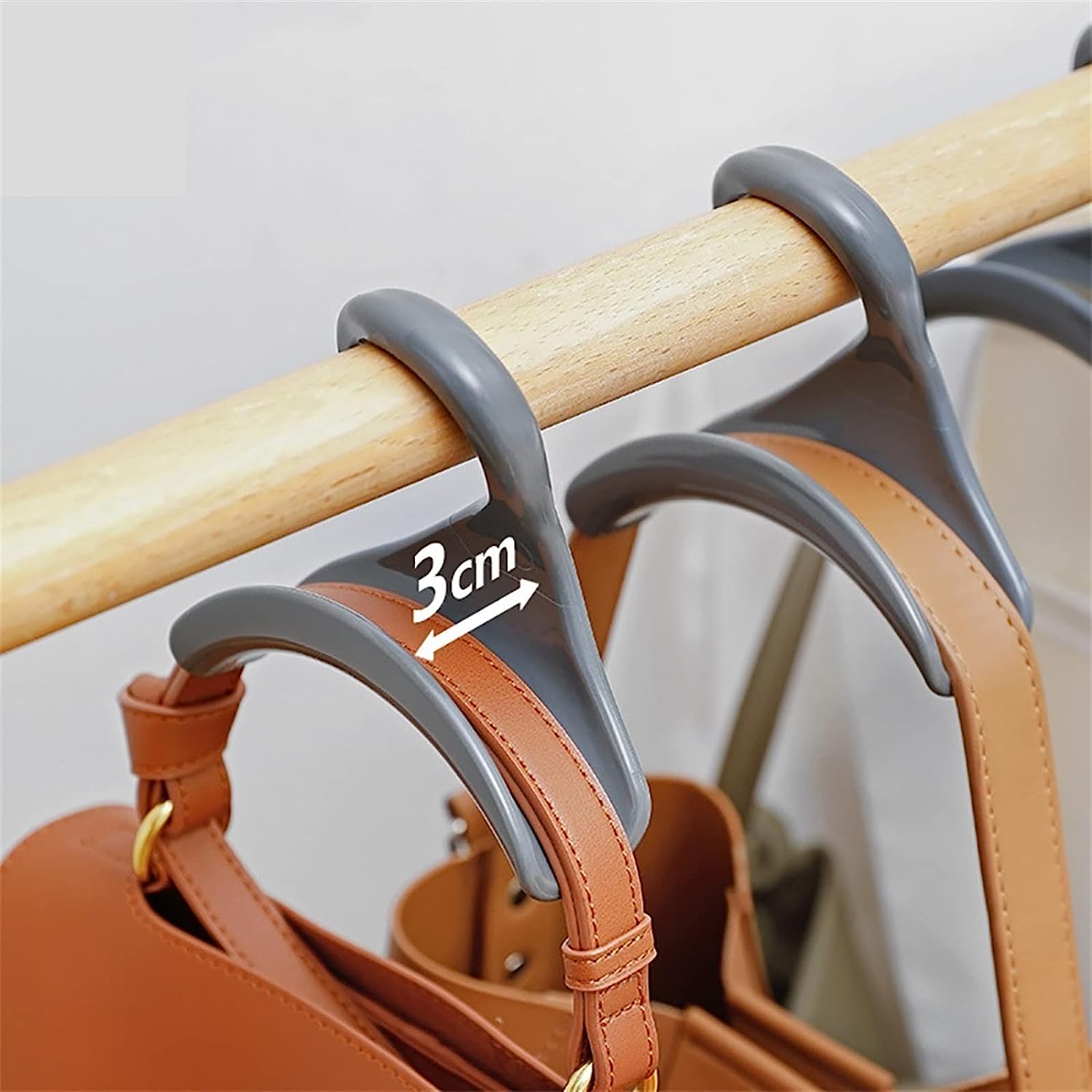 Neatly arranged rack featuring multiple bags suspended on space-saving hanger hooks, perfect for organizing bags, belts, and scarves in a compact manner