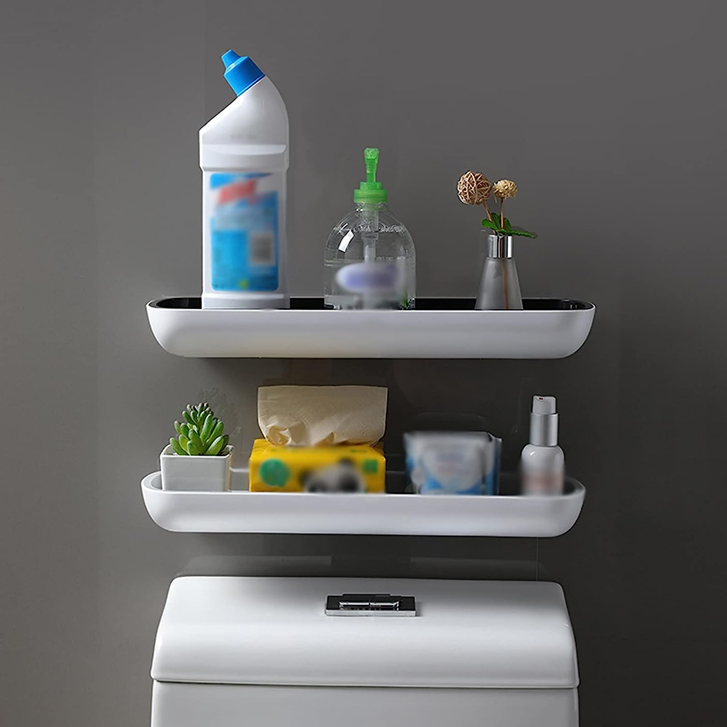 A wall-mounted bathroom storage rack with a shelf positioned above a toilet, providing convenient storage space without the need for drilling