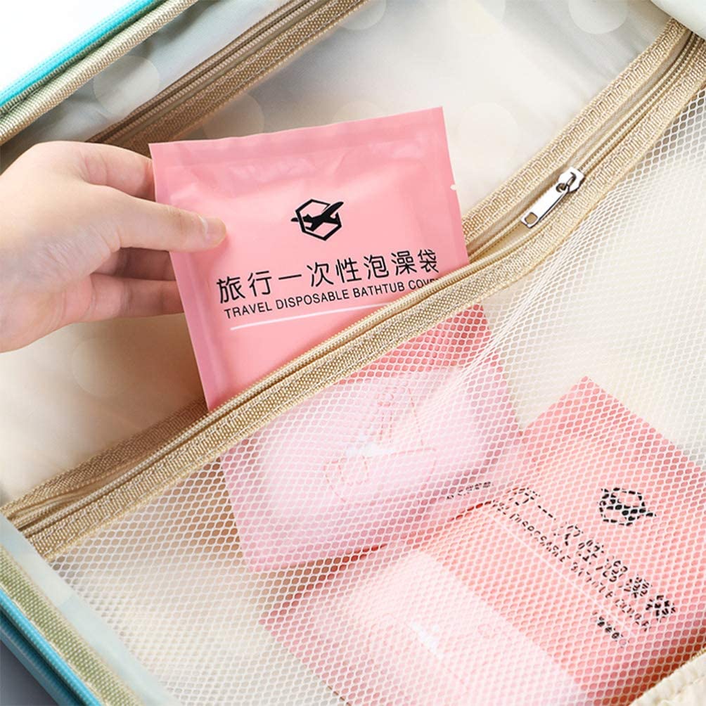 Someone taking a pack of portable clear disposable bathtub bathing cover