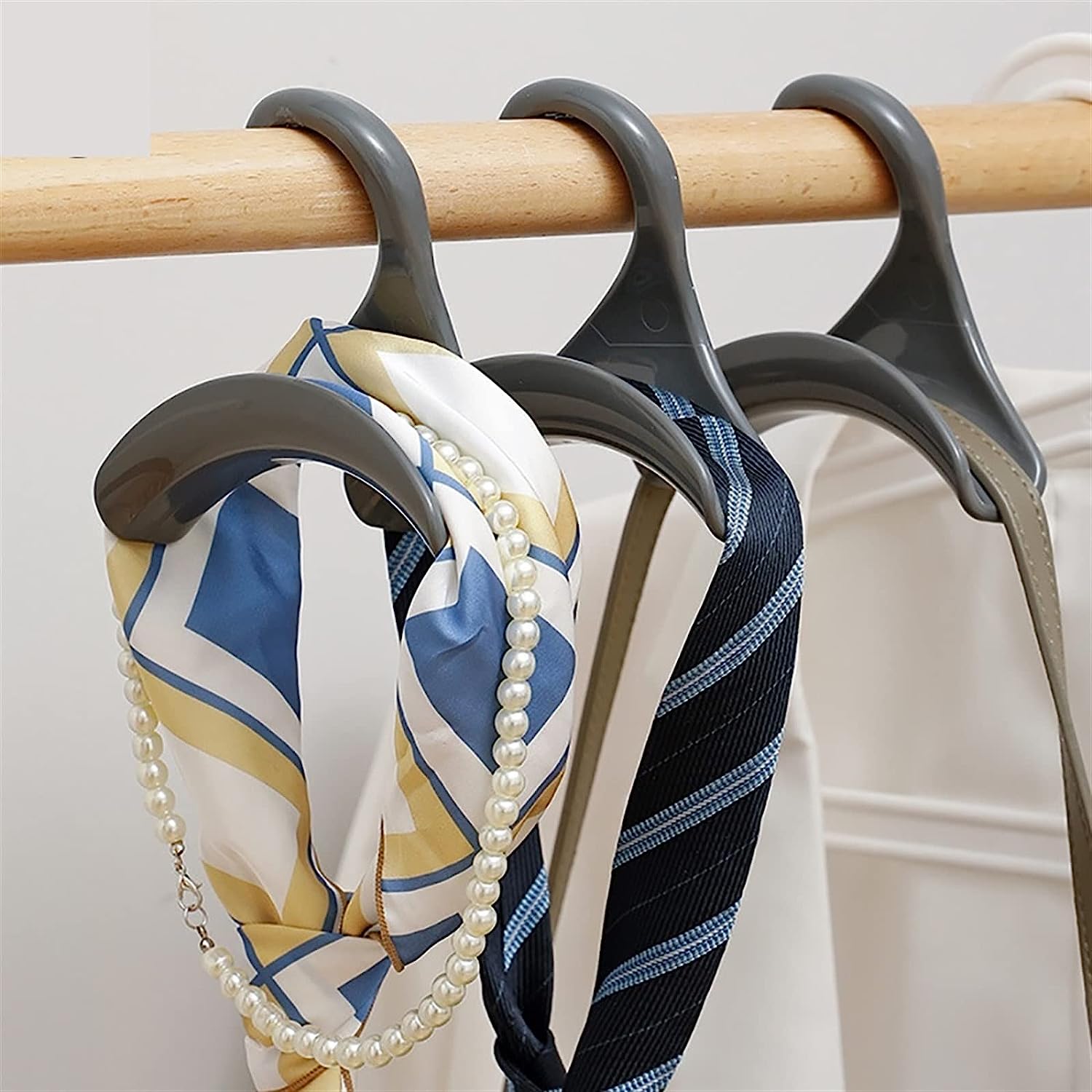 Efficiently organized rack showcasing various bags hung on specialized hanger hooks, ideal for saving space while organizing bags, belts, and scarves