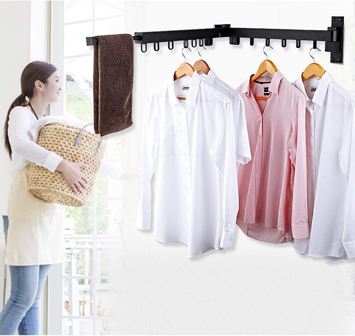Extended Collapsible Drying Hanger mounted on a wall with shirts hung on it 