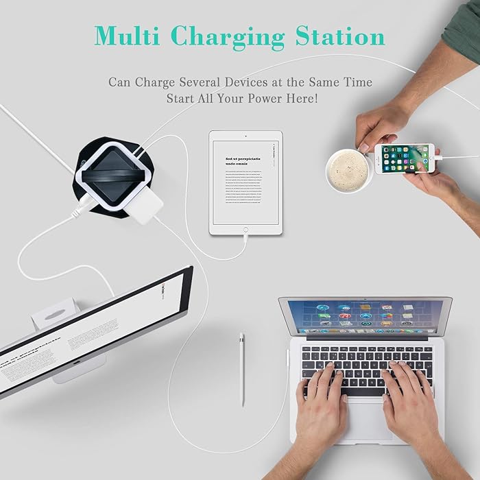 Two people multitasking with a laptop and phone charging on a vertical socket power strip surge protector equipped with USB ports
