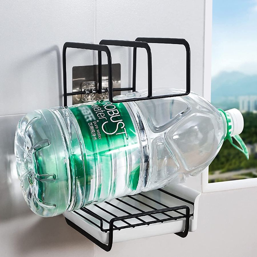 A bottle placed on the Wall Mounted Kitchen Storage Stand Sink Rack Sponge Drainer Organizer