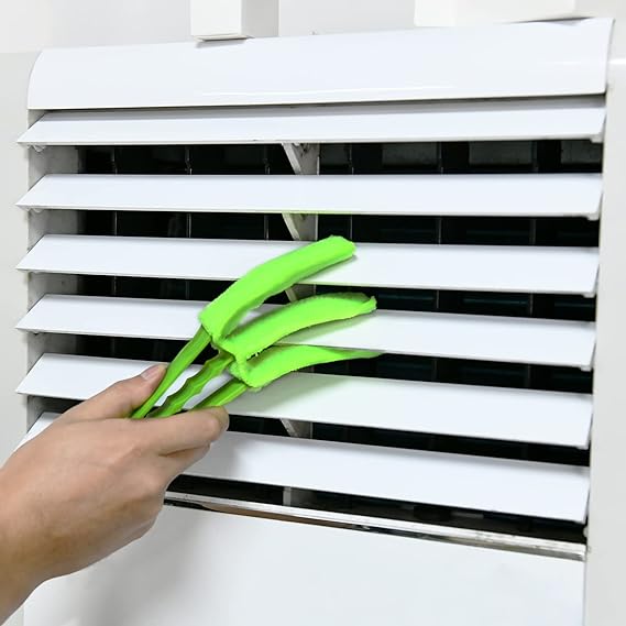 someone cleaning air conditioner wing using Window Blinds Cleaner Duster Brush