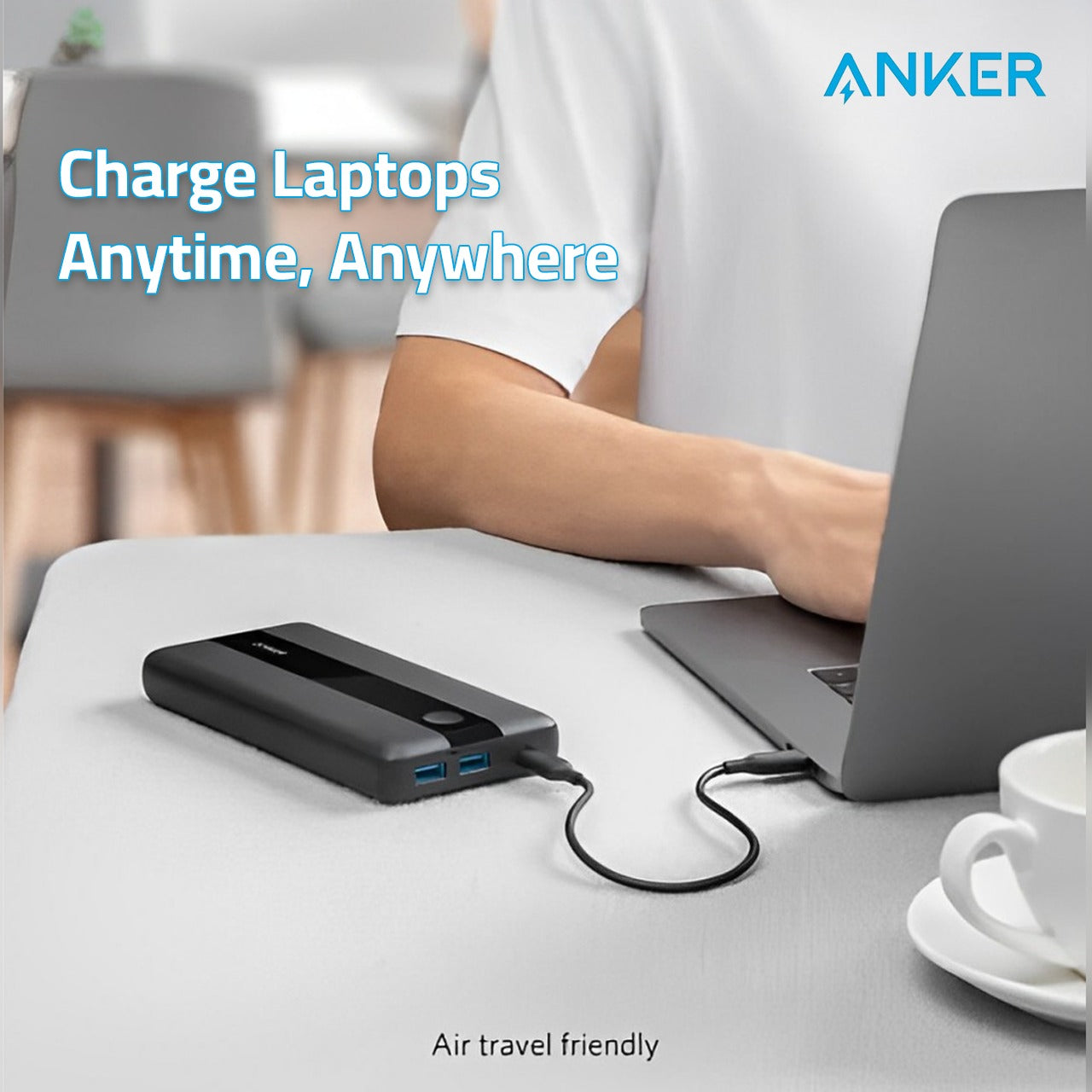 A Person Uses Laptop While Charging Using ANKER PowerCore III 19K High-Speed Portable Laptop Charger.