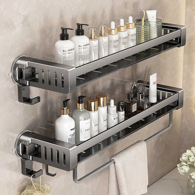 A Bathroom shelf rack is Attached to the Wall Of Bathroom Area Organized with Shower Items.