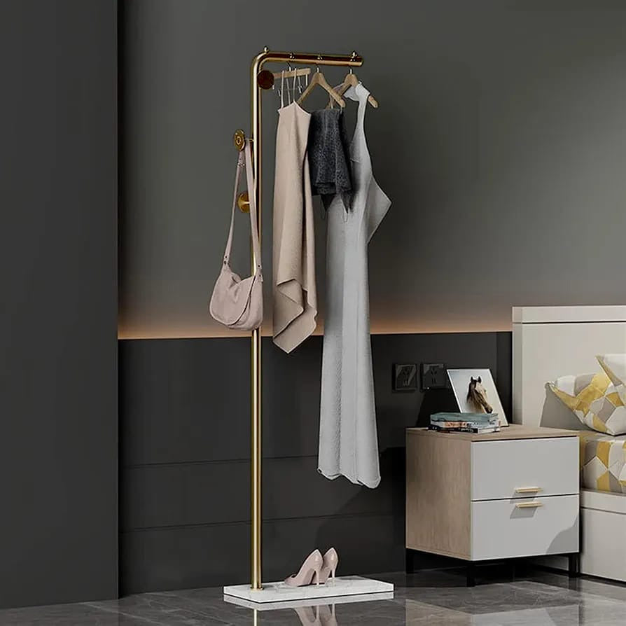 A Coat Rack Stand with Coats, Bag, Shoes are Organized On the Side Of the Bedroom.