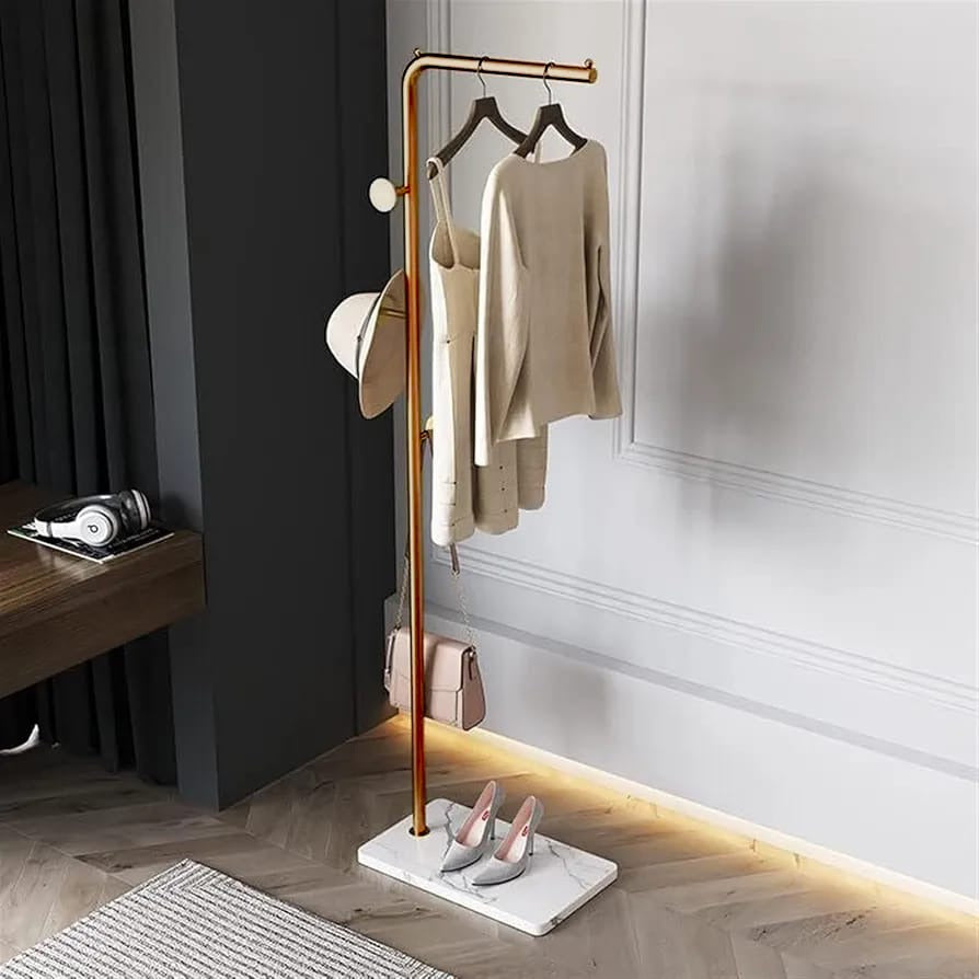 A Coat Rack Stand with Coats, Bag, Shoes and Hat are Organized.