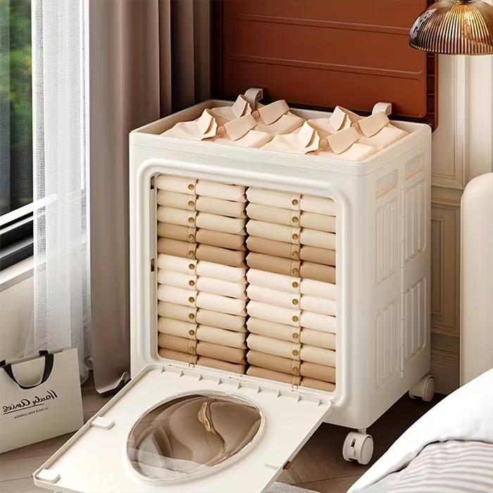 A Foldable Cloth Storage Organizer Box is kept on the side of modern room neatly filled with folded clothes.