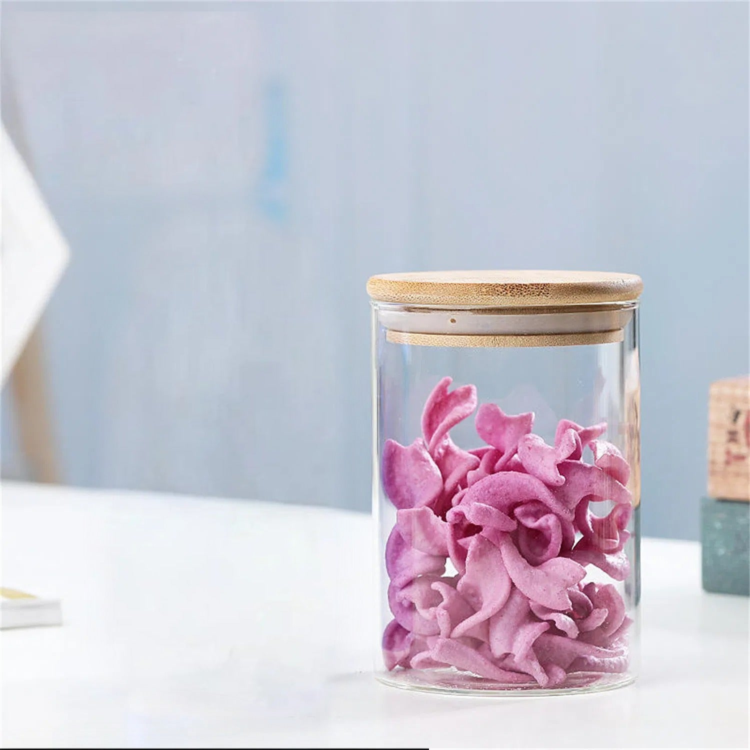 A Glass Storage Jar is Stored with Snacks.