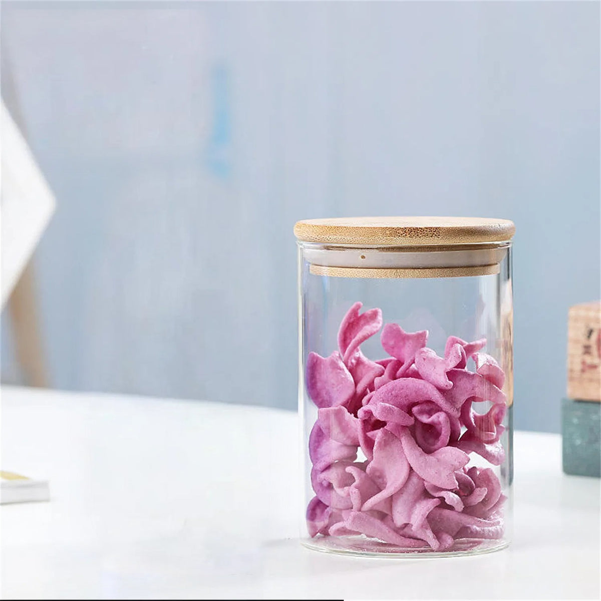 A Glass Storage Jar is Stored with Snacks.
