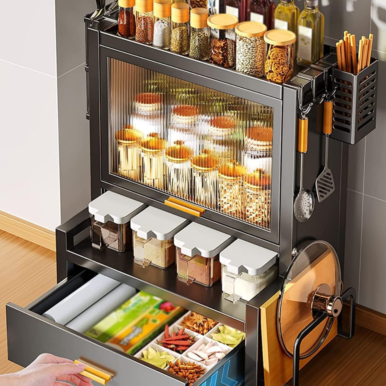 A Person is Opening the Door Of A Kitchen Countertop Spice Rack.