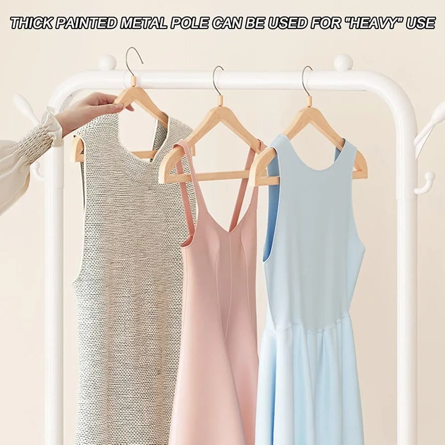 A Person is Hanging Clothes On Multifunctional Cloth Rack with Shoe Stand.