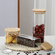 A Set Of Glass Storage Jars  are Filled with Snacks.