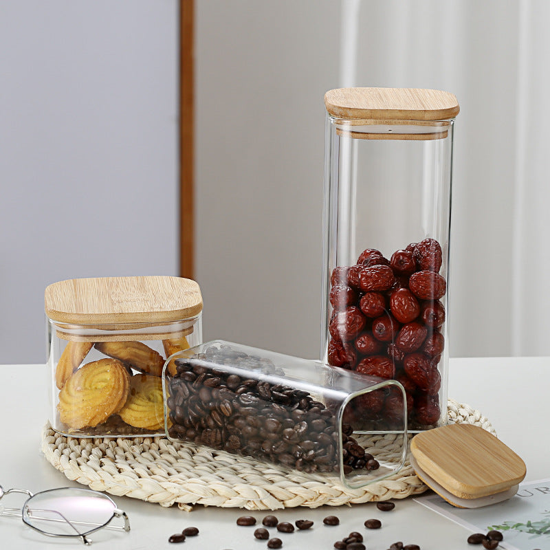 A Set Of Glass Storage Jars  are Filled with Snacks.