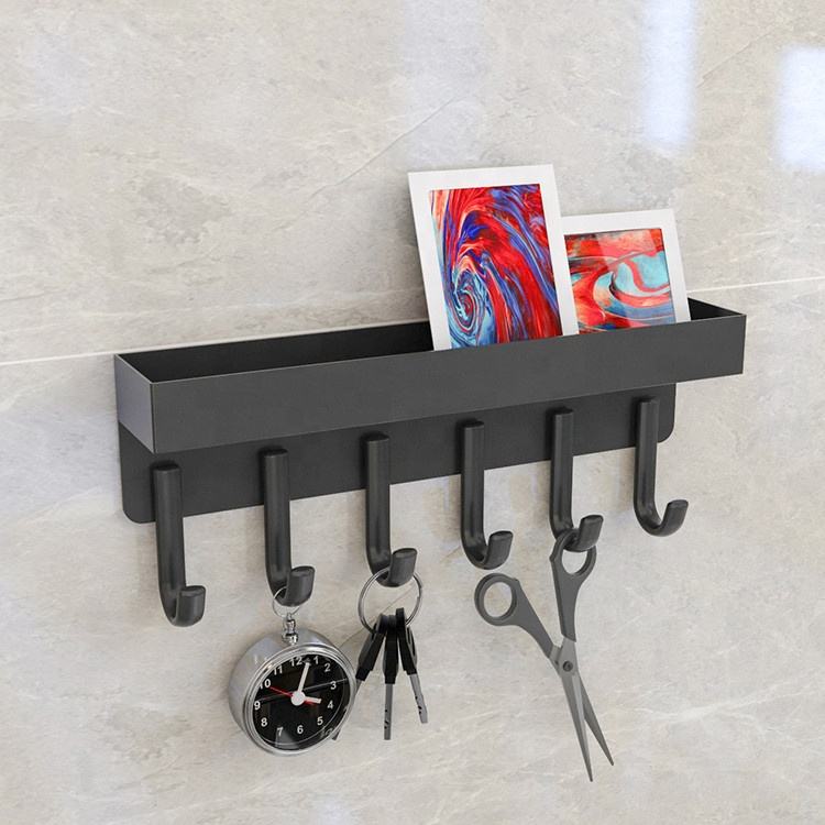 A Wall Mounted Key Holder with Storage Organizer is Organized with Various Essentials.