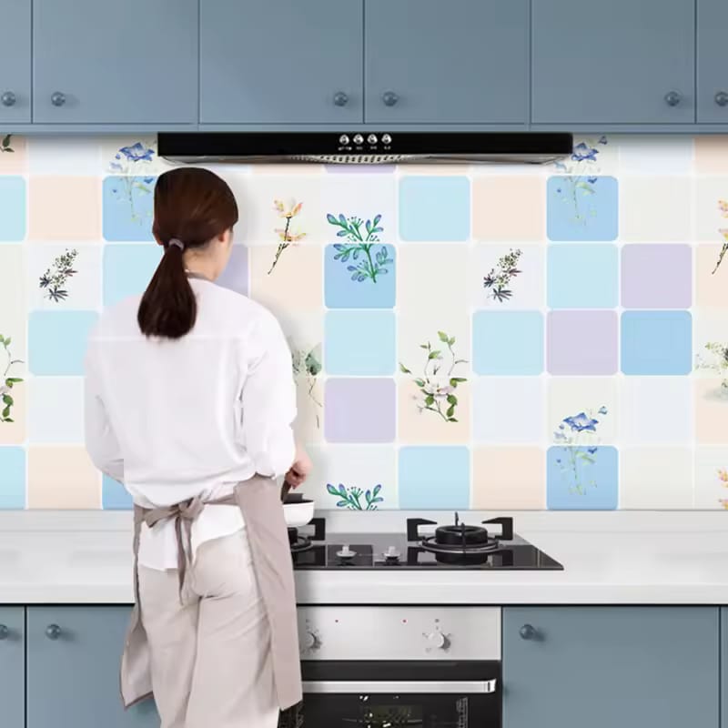 A Waterproof Self Adhesive Oil Proof Kitchen Bathroom Wallpaper is Sticked On the Wall Of a Kitchen Where a Women is Cooking.