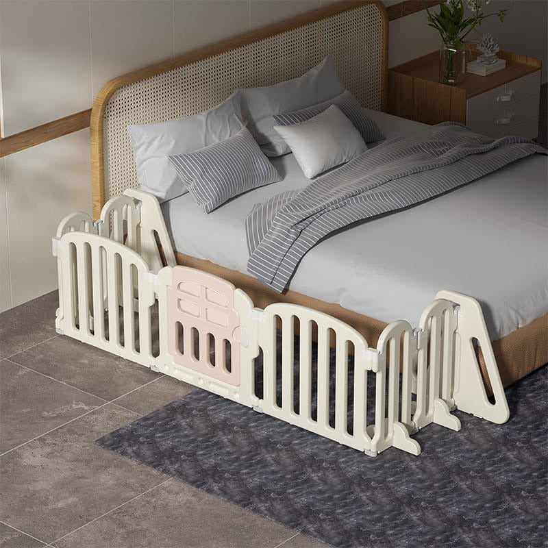 A baby playpen set up in a Bedroom.