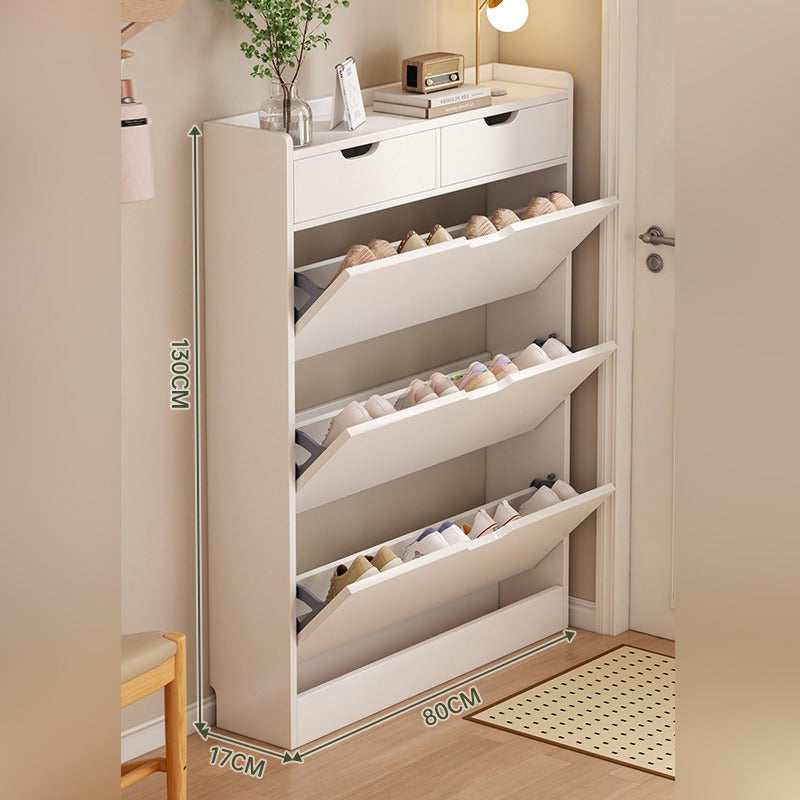 A slim shoe cabinet with flip drawers that neatly stores shoes while saving space, with a top surface for décor or essentials.
