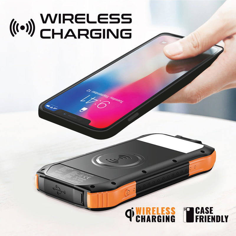 A smartphone hovering above a rugged power bank, demonstrating wireless charging functionality.
