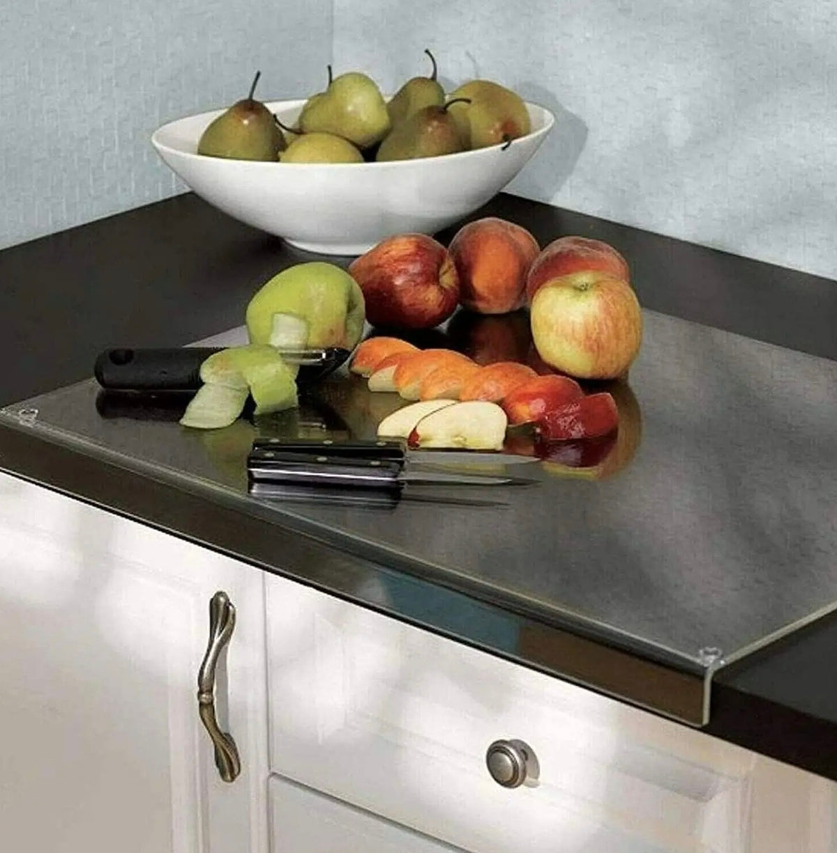 Fruits and Knives are Placed on an Acrylic Cutting Board.